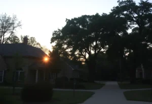 A tranquil neighborhood scene symbolizing community and legacy.