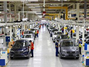Workers assembling cars at an Alabama auto plant