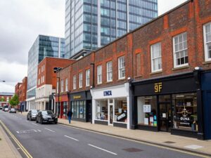 A panoramic view of Birmingham's vibrant business district with entrepreneurs and small businesses.