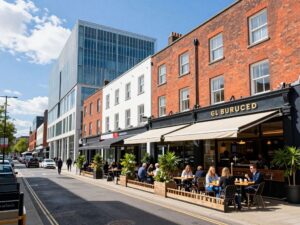 A vibrant street in Birmingham featuring new dining options.