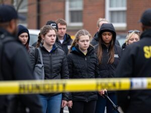 Community gathering in Birmingham showing support after a tragic shooting incident.